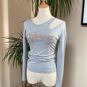 Sexy grey sweater with cutouts and sequined logo.